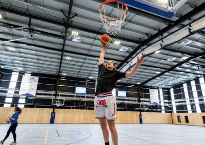 University of Auckland student shooting a hoop in basketball
