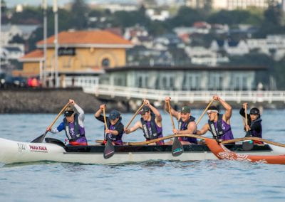 The faculty of Engineering team paddling on the water in a Waka