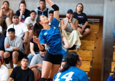University of Auckland student serving in a Volleyball game
