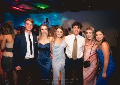 Six students posing for a photo at the hall ball