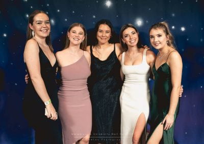 Five students posing for a photo at the hall ball