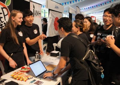 Groups of students talking at clubs expo