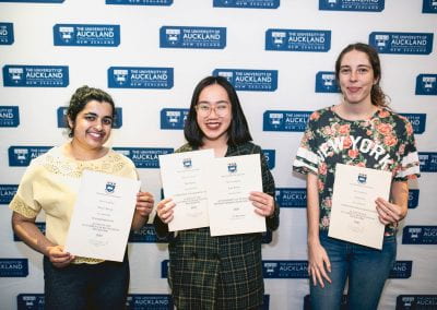 Three women standing with their certificates