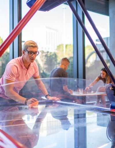 Students playing airhockey