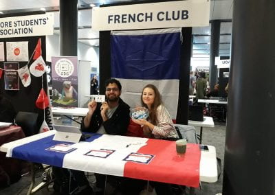 Two French Club students at desk